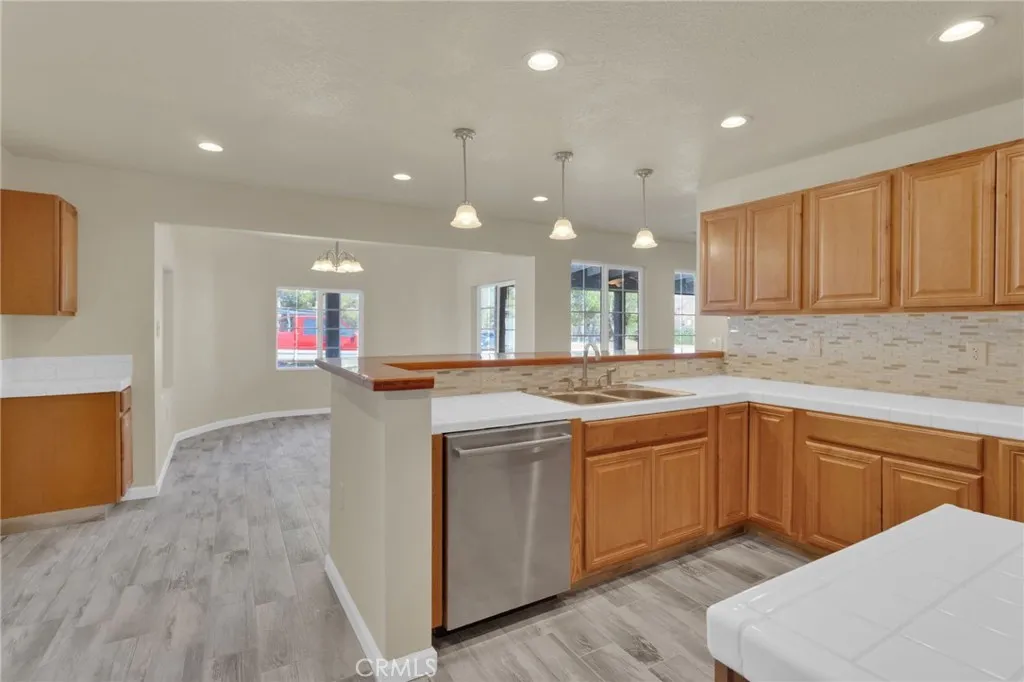 Functional kitchen layout featuring ample cabinetry, workspace, and direct connection to the main living areas.