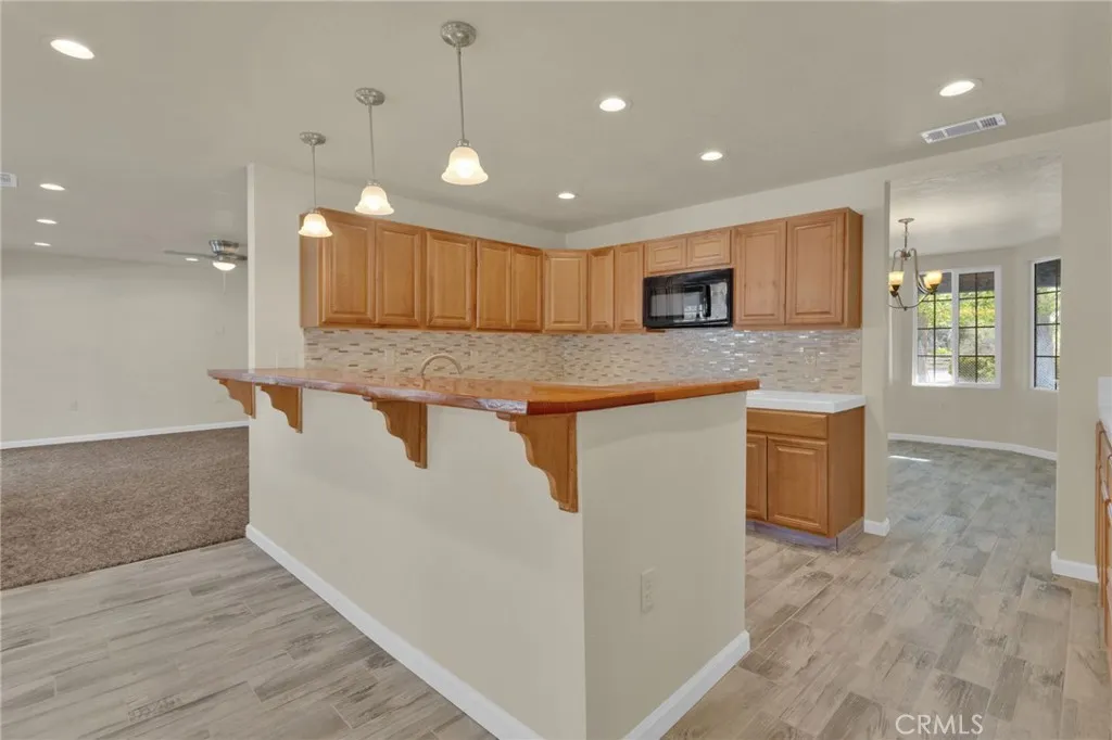 Functional kitchen layout featuring ample cabinetry, workspace, and direct connection to the main living areas.