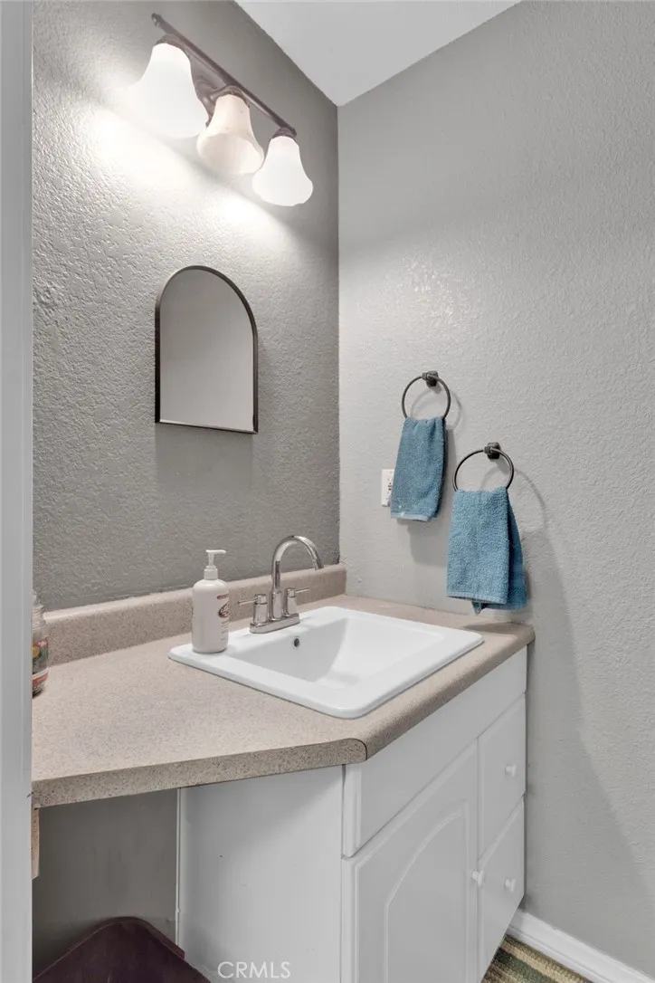 Detached shop featuring a bathroom and living space, offering potential for workshop use, storage, or future conversion.