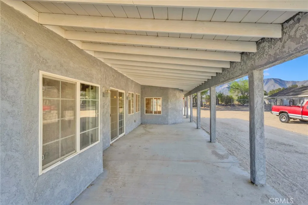 Covered patio area perfect for enjoying the surrounding desert views and outdoor living year-round.