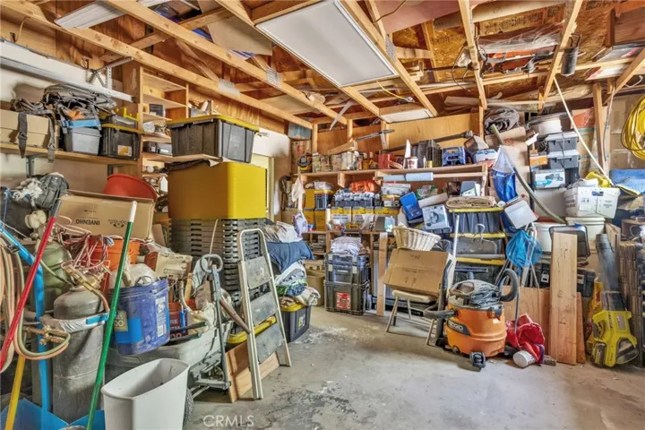 2 Car Garage on Detached shop featuring a bathroom and living space, offering potential for workshop use, storage, or future conversion.