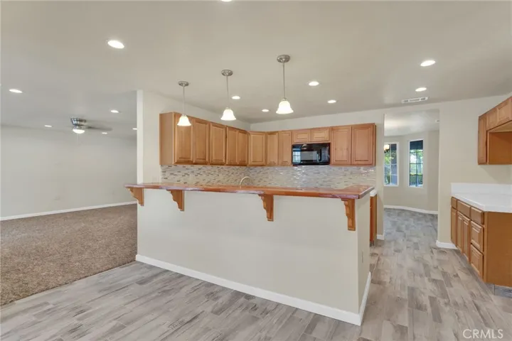 Functional kitchen layout featuring ample cabinetry, workspace, and direct connection to the main living areas.