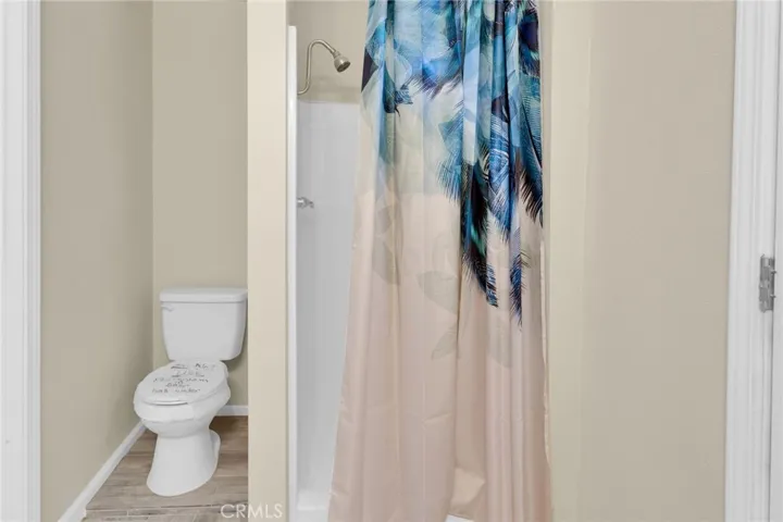 Convenient cabana-style bathroom with direct access, ideal for use from outdoor areas and everyday functionality