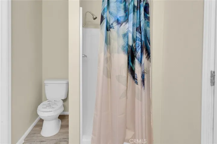 Convenient cabana-style bathroom with direct access, ideal for use from outdoor areas and everyday functionality