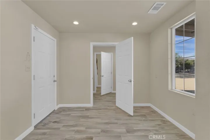 Private office area located on a separate end of the home, offering a quiet and functional space ideal for remote work, study, or additional flex use.