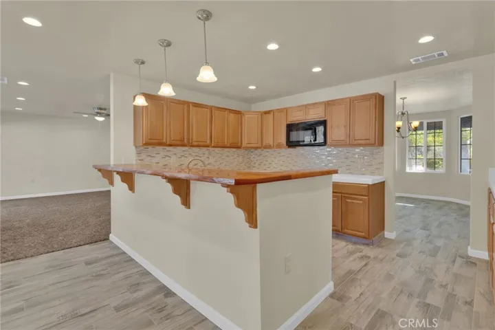 Functional kitchen layout featuring ample cabinetry, workspace, and direct connection to the main living areas.