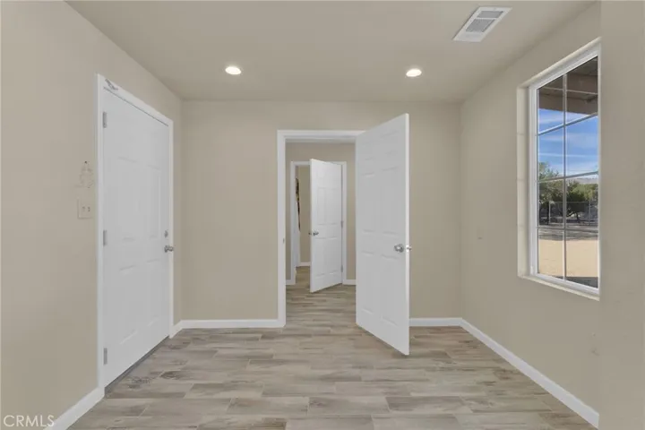 Private office area located on a separate end of the home, offering a quiet and functional space ideal for remote work, study, or additional flex use.