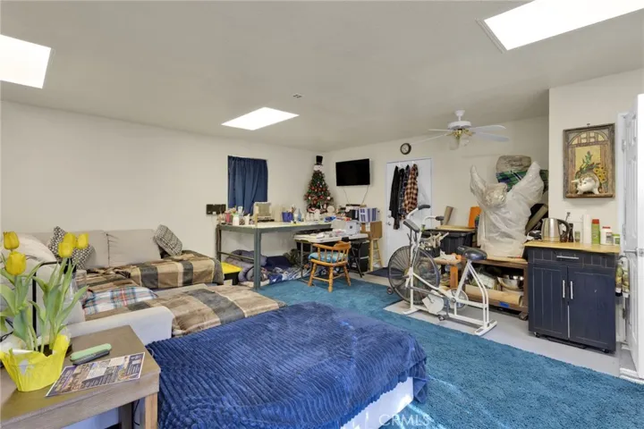 Detached shop featuring a bathroom and living space, offering potential for workshop use, storage, or future conversion.