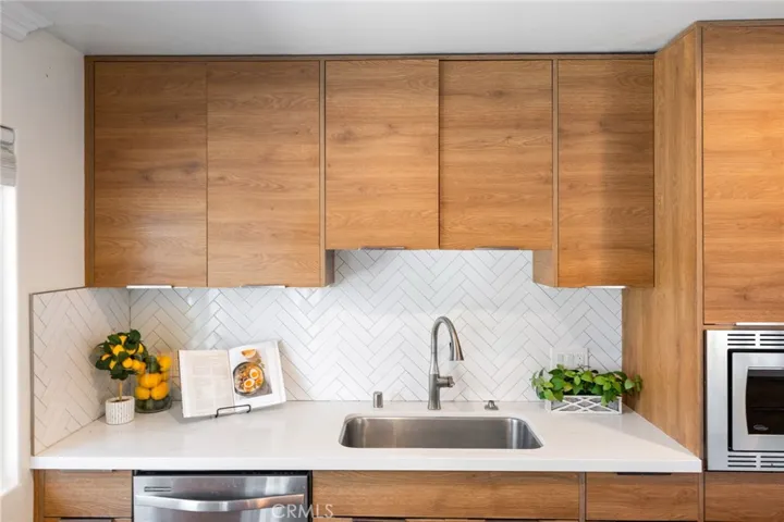 Deep Utility Sink, Custom Contemporary Self-Closing Cabinetry and Deep Drawers