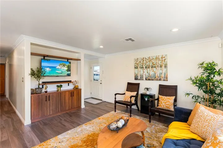 Entry Door and Living Room with Custom Built-In Entertainment Cabinets
