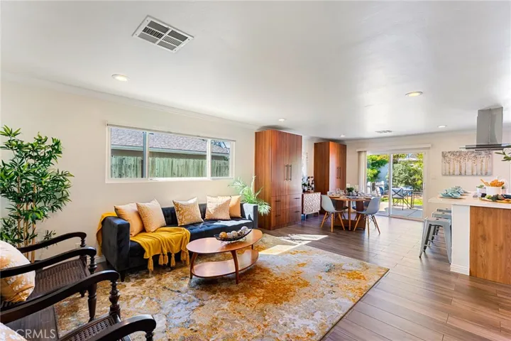 Great Room Design. Wood-Grain Porcelain Tile Flooring, Crown Molding, LED Recessed Lighting, Custom Built-In Cabinetry