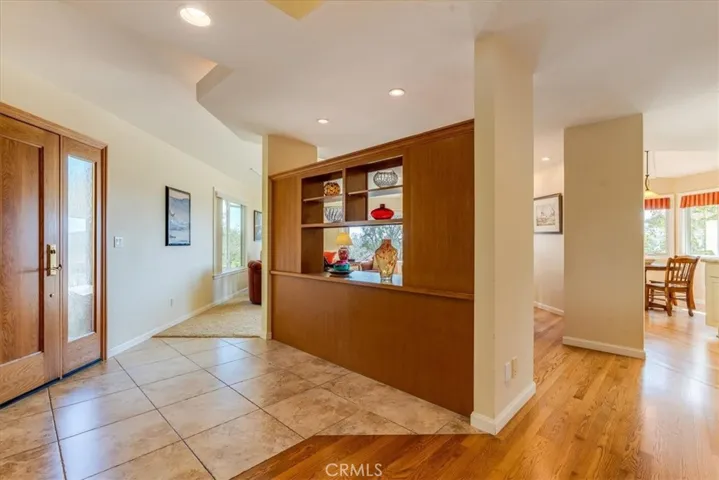 Cabinetry separates the entry and the dining room.