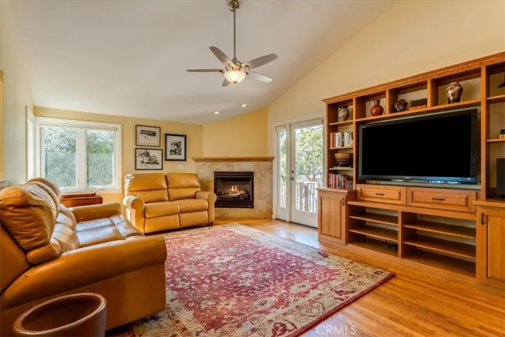Family room has a gas fireplace and built in cabinetry.
