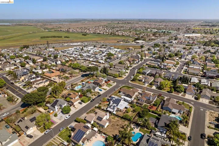 View of property location with nearby suburban area