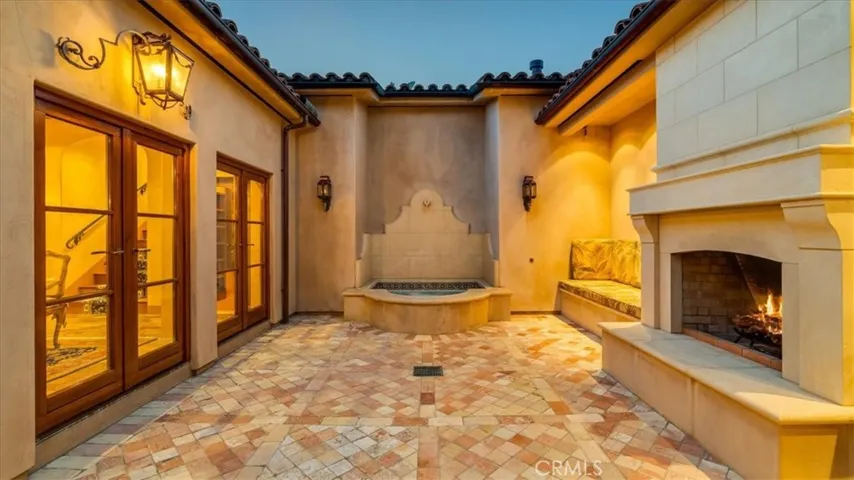 Gas lit lanterns make the patio glow.
