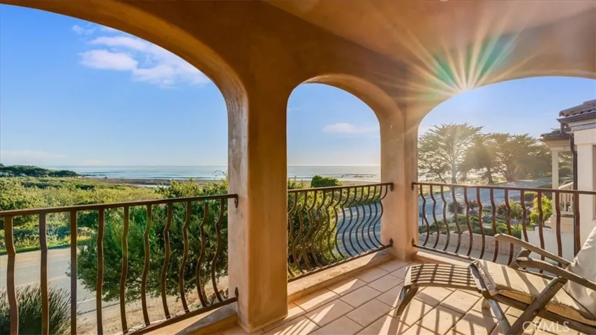 Primary Bedroom's stone patio overlooks the sea.
