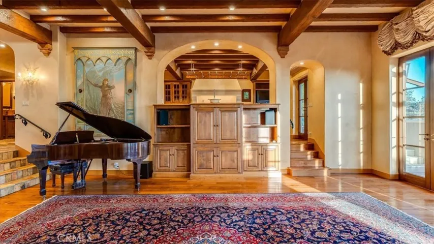 The living room is open to the dining room and visually open to the kitchen