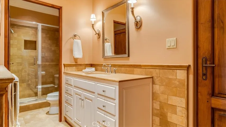 The bathroom that lies between the second bedroom and office has a shower only.