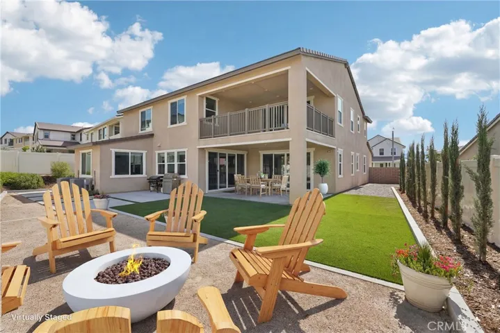 Expansive pool-size backyard with covered patio & balcony