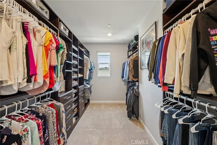 Spacious primary walk-in closet