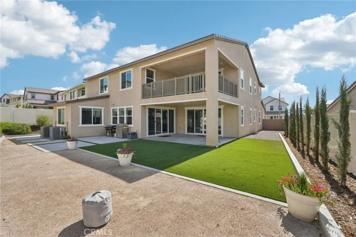 Expansive pool-size backyard with covered patio & balcony