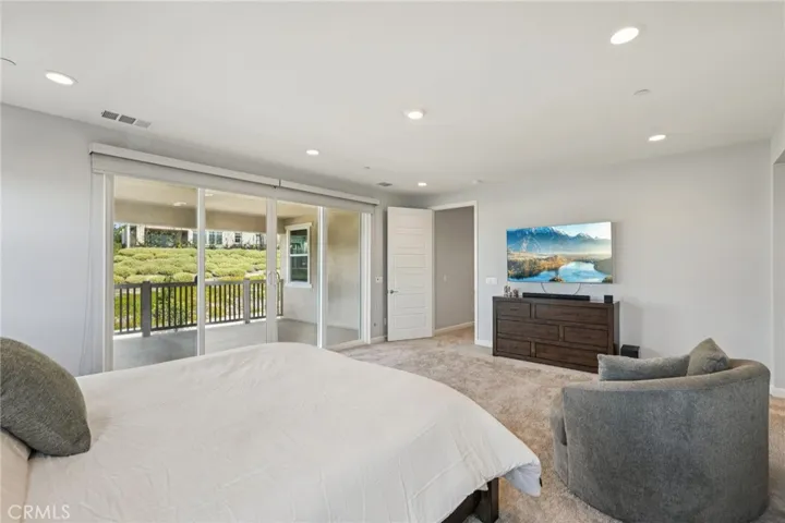Spacious primary with balcony access