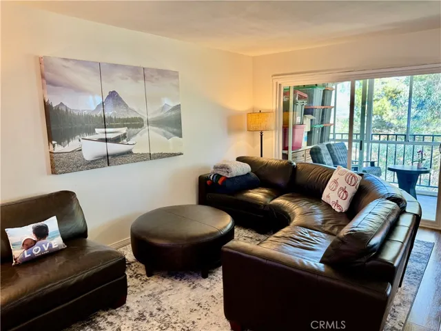 Large Living Room Area with Sliding Door Access to Enclosed Patio