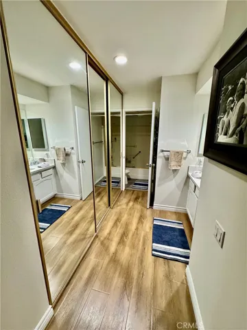 Primary Dressing Area with Vanity and Wardrobe CLosets