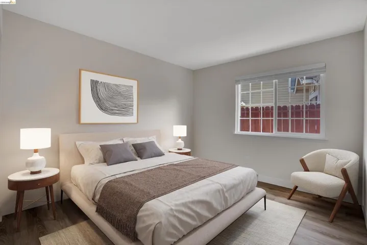 Bedroom featuring wood finished floors and baseboards