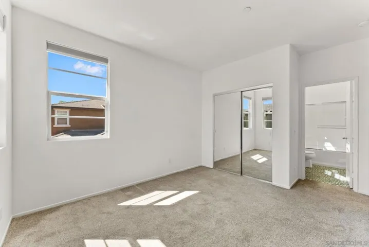 Upstairs bedroom with attached full bathroom