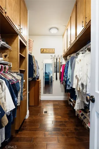 Huge walk-in closed with built in organization.