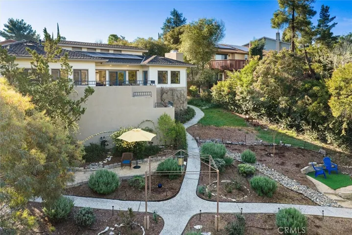 Terraced back yard with multiple flattened areas for flexible use.