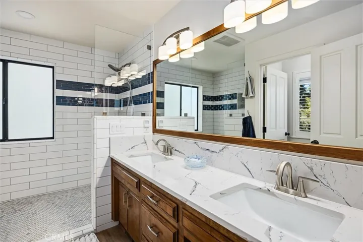 Primary bathroom with dual sink vanity.
