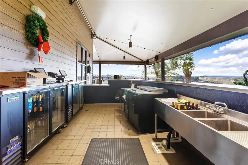 Spacious outdoor Wine Serving area under large patio roof