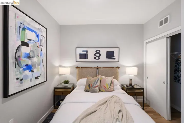 Bedroom featuring wood finished floors and a closet