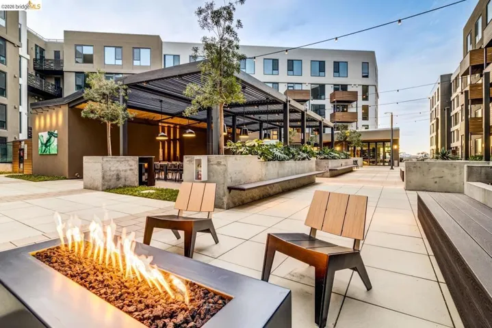 View of home's community with a fire pit and a pergola