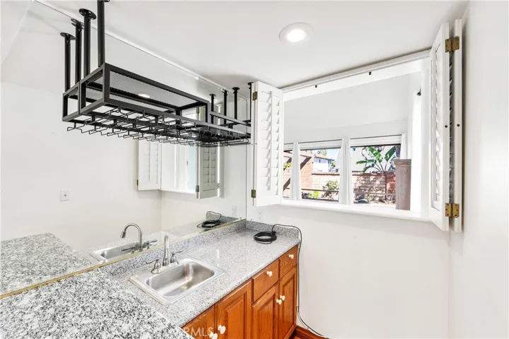 Detail of the bar with a pass thru to the living room.