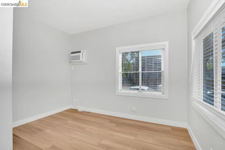 Unfurnished room with baseboards and light wood-style​​‌​​​​‌​​‌‌​​‌​​​‌‌​​​‌​​‌‌​​‌‌​​‌‌​​​​ flooring