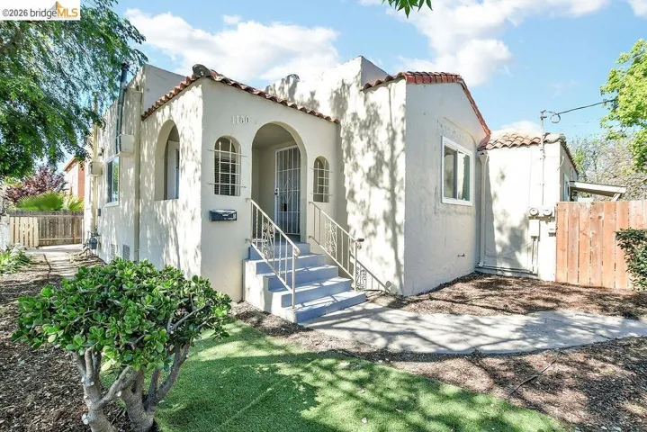 Mediterranean / spanish-style home featuring a tile roof and stucco siding