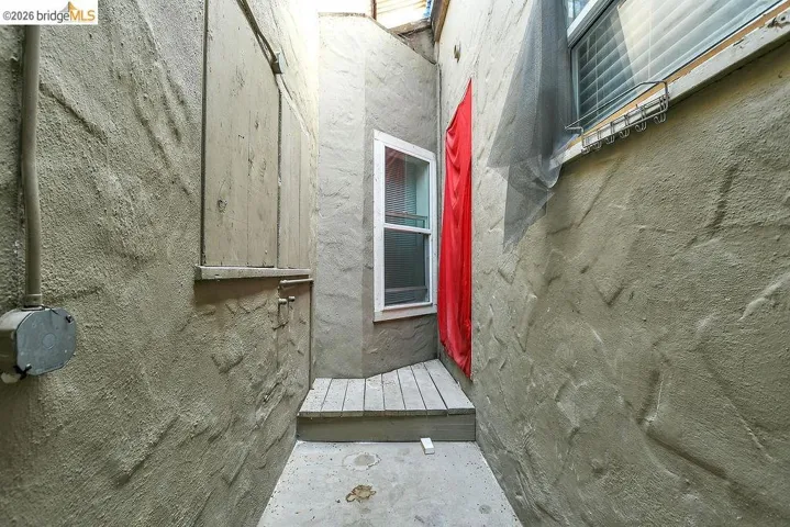 Property entrance with a wooden deck