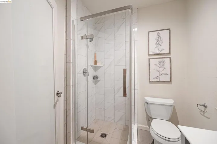 Full bathroom featuring a stall shower and vanity