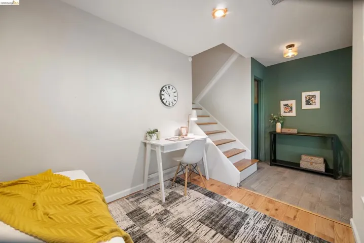 Office space with light wood-type flooring and baseboards