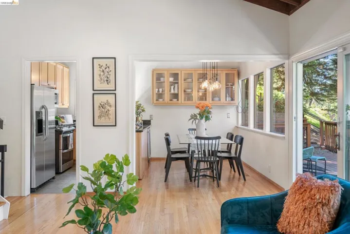 Dining space featuring hanging lights and light wood-style floors