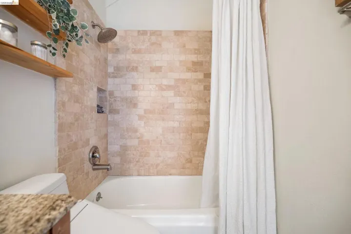 Full bath with shower / tub combo and vanity