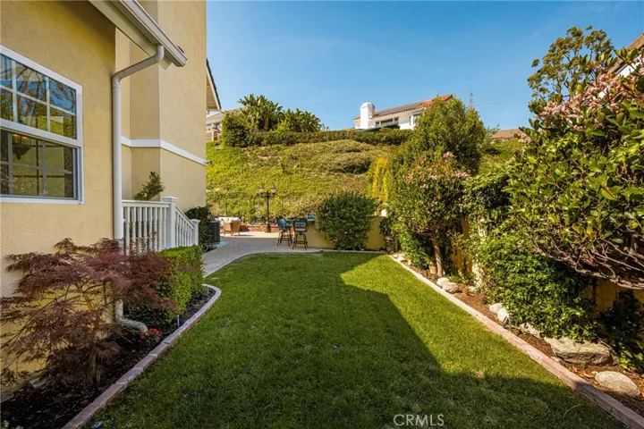 Grassy side yard is a perfect play space for kids or pets!