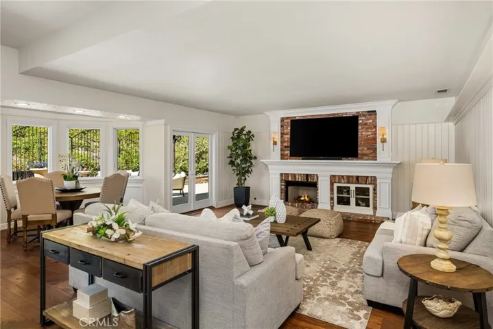 Enjoy casual dining surrounded by bay windows overlooking the pool and lush hillside.