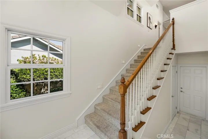 You can never have too much storage with a large closet under the stairs and direct access to your 3 car garage. Stairs lead to the custom addition of a game/bonus room.