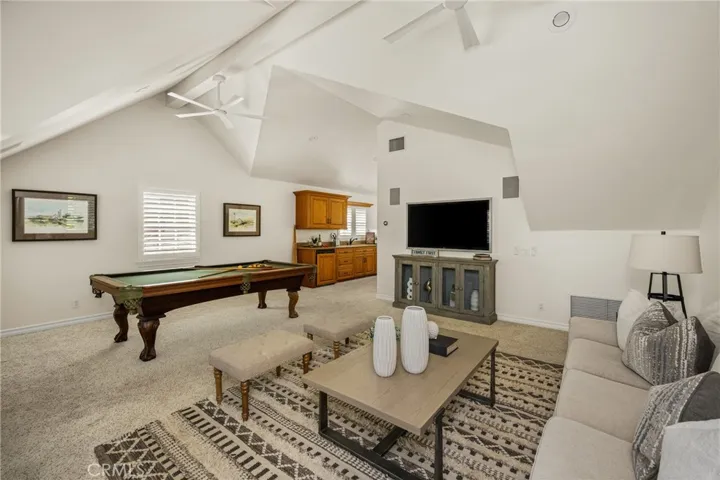 Custom bonus room added over the garages, complete with a mini kitchen and full bath!