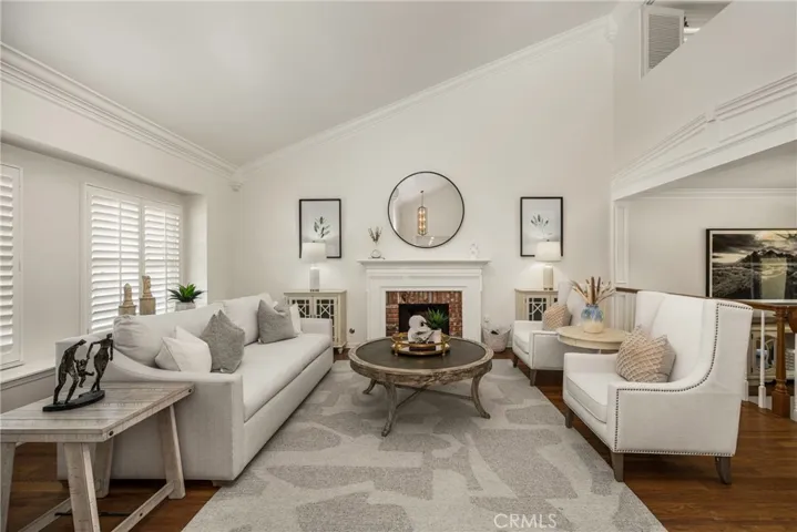 Vaulted ceilings and crown molding add elegance to the formal living room.