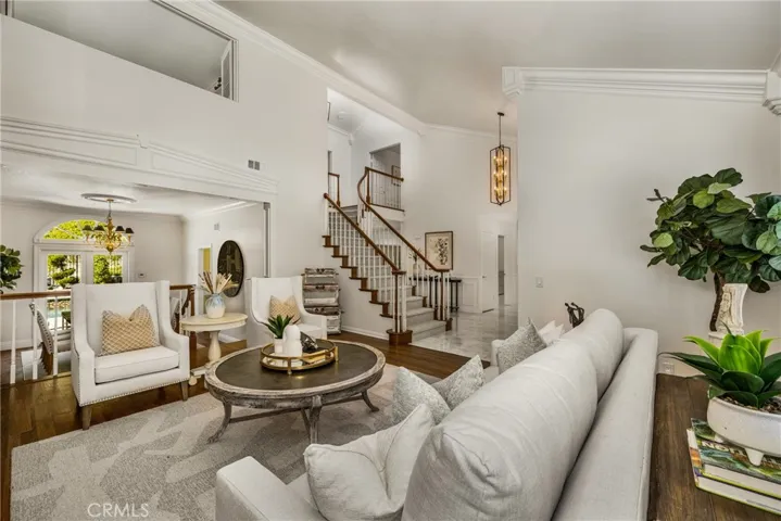 View of the rich, hardwood flooring in the formal living room, which extends into the adjoining formal dining room.
